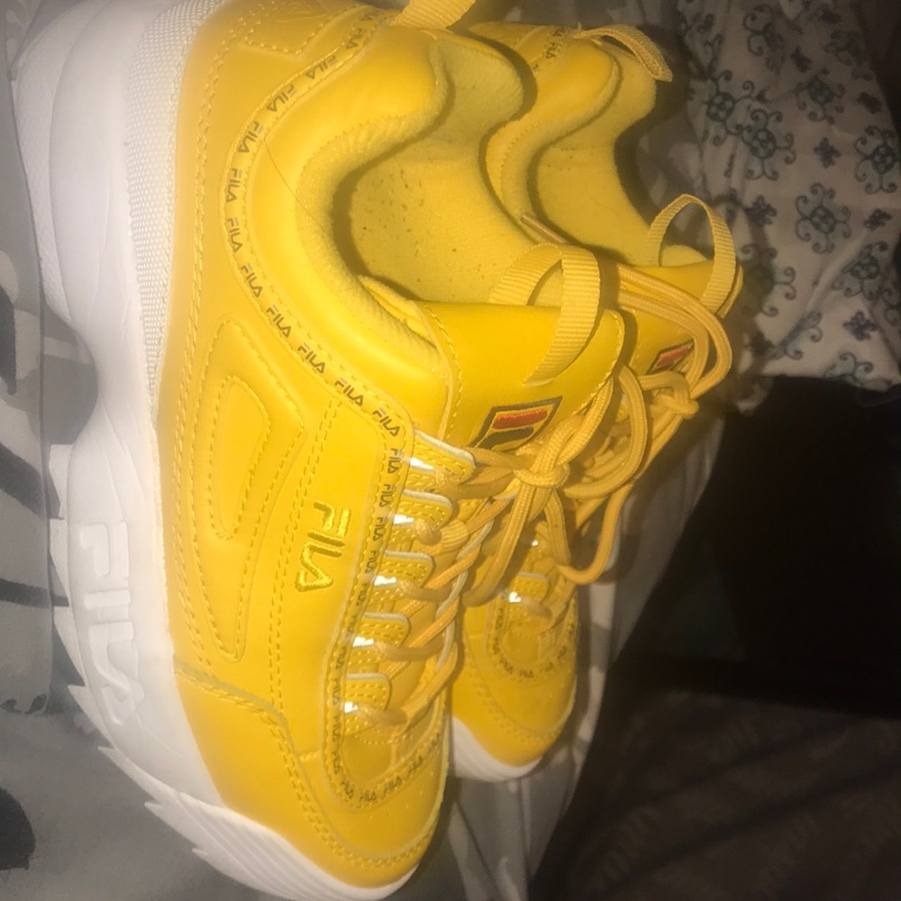 Yellow fila shoes.